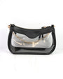 Black handbag with clear front section and gold chain strap on a white background