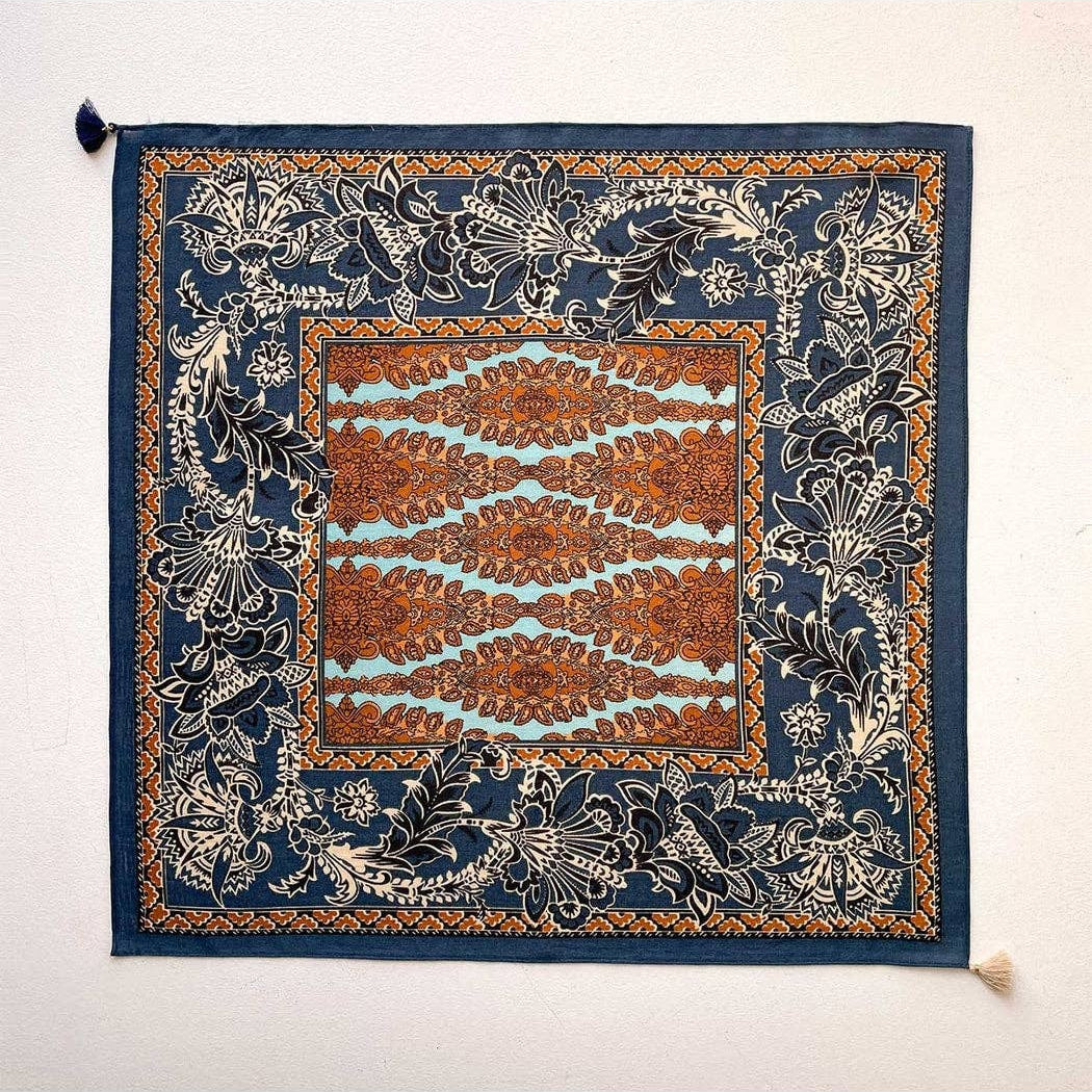 Navy retro floral square scarf, flat lay with ornate border and small tassel ends