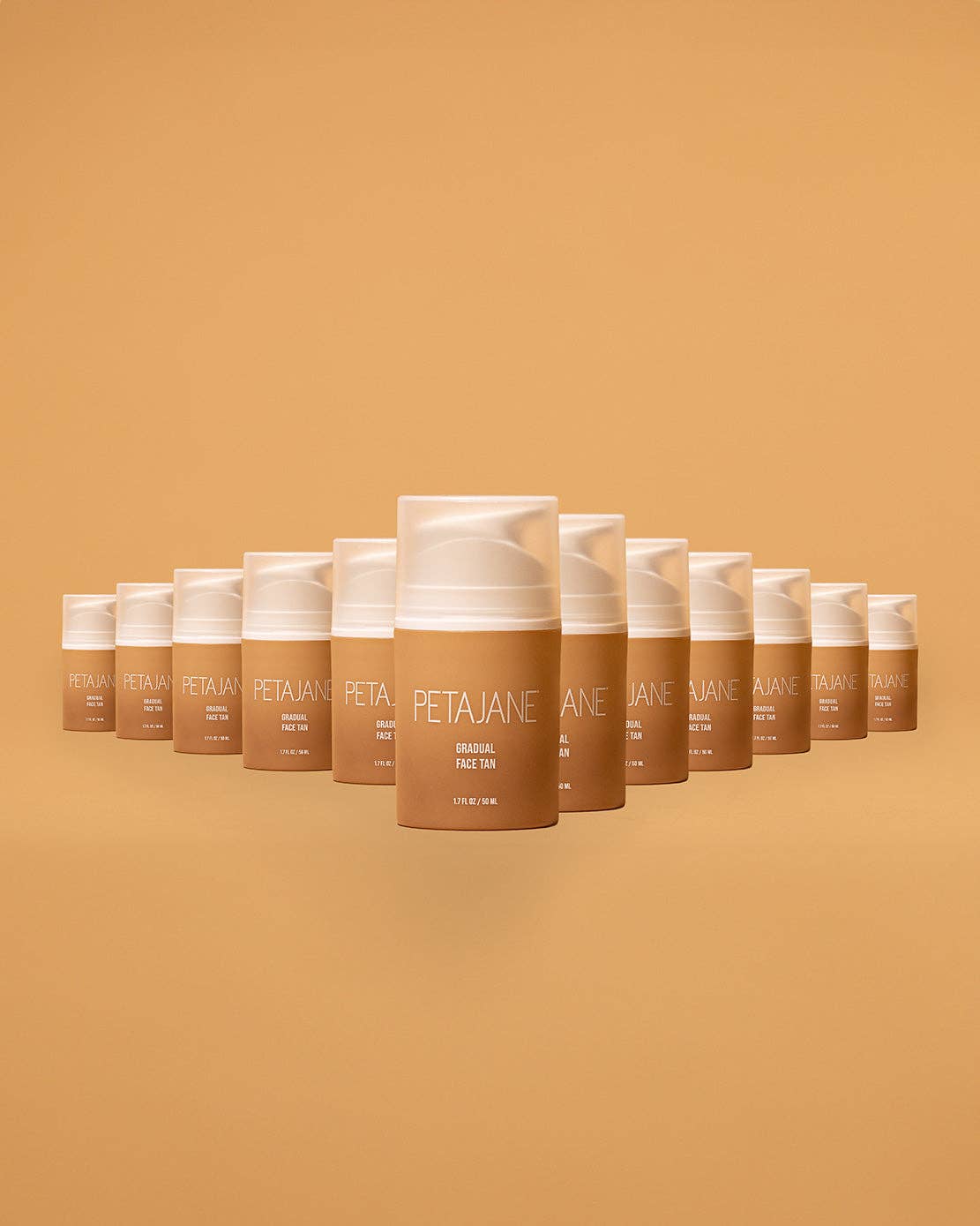 Row of Peta Jane sunless tanning products on a matching brown background