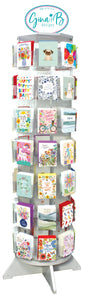 Spinning display of greeting cards with various designs on a white background