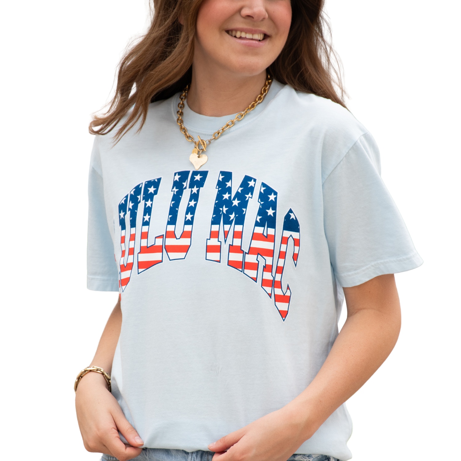 Person wearing a light blue t-shirt with 'LULU MAC' design featuring American flag colors on a white background
