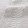 Close-up of a textured gray fabric with visible stitching