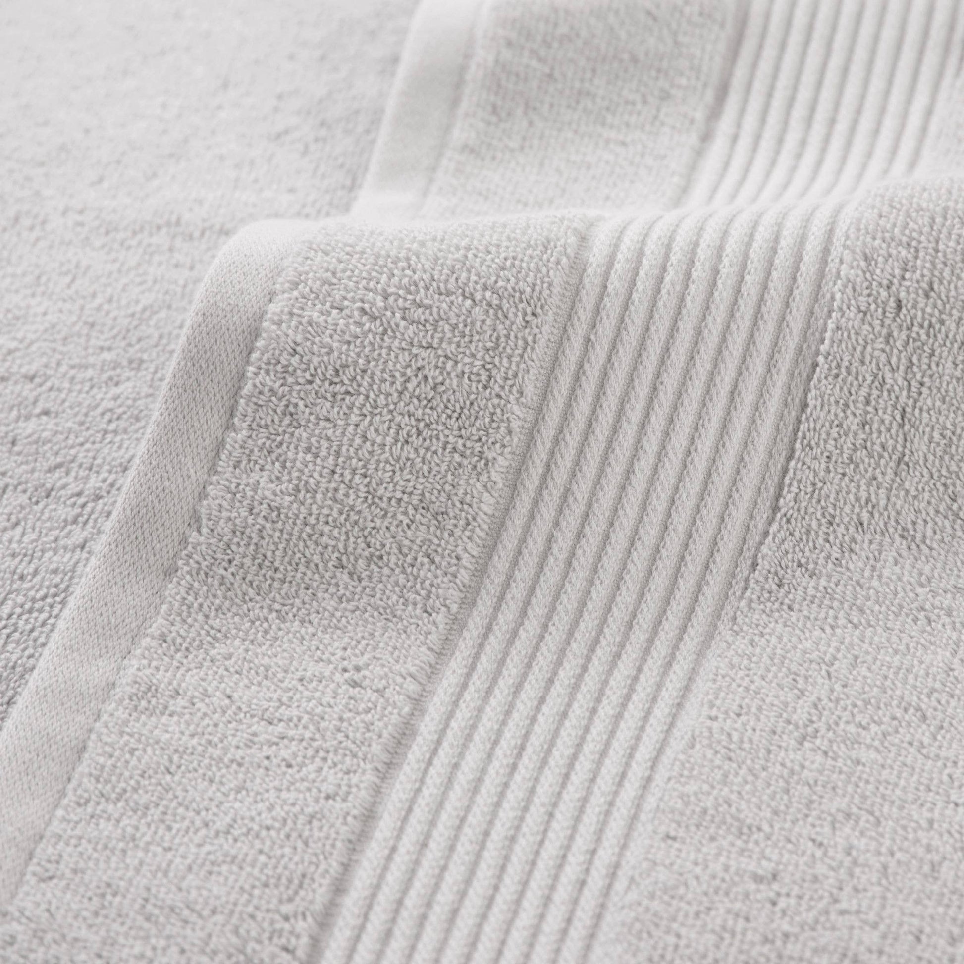 Close-up of a textured gray fabric with visible stitching