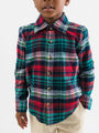 Child wearing a red, green, and blue plaid shirt on a white background