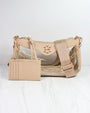 Beige handbag with clear section on a white background