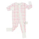 White baby onesie with pink plaid pattern on a white background