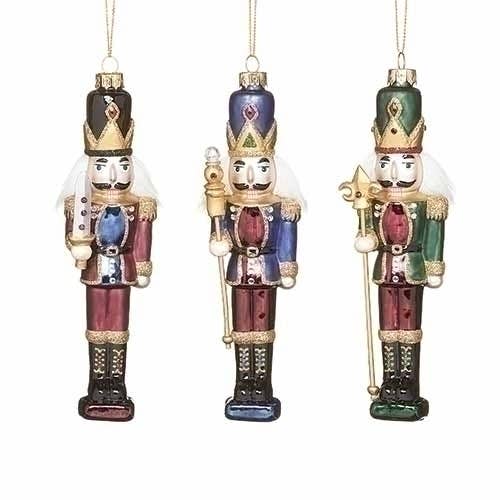 3 Nutcracker Ornaments with colorful decor on a white background
