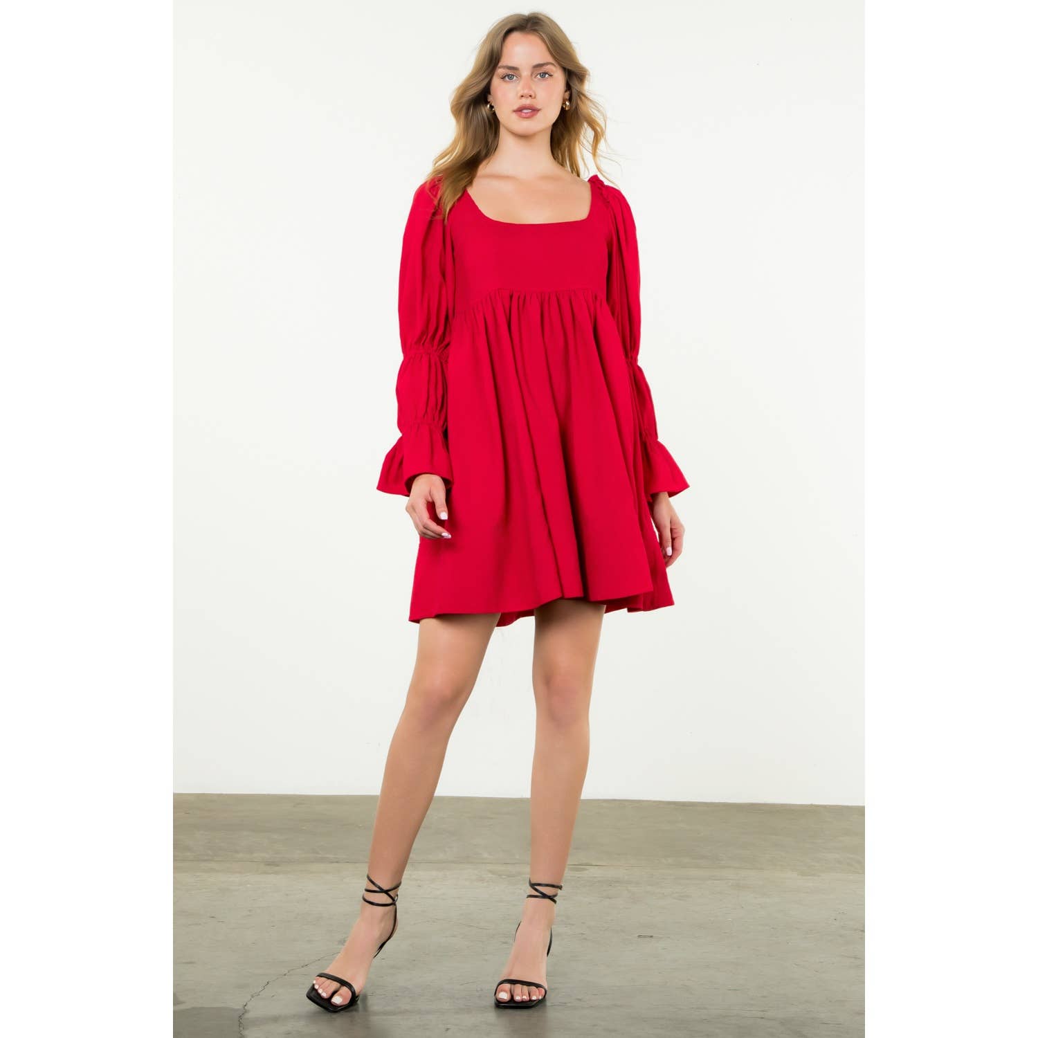 Woman wearing a red dress on a white background