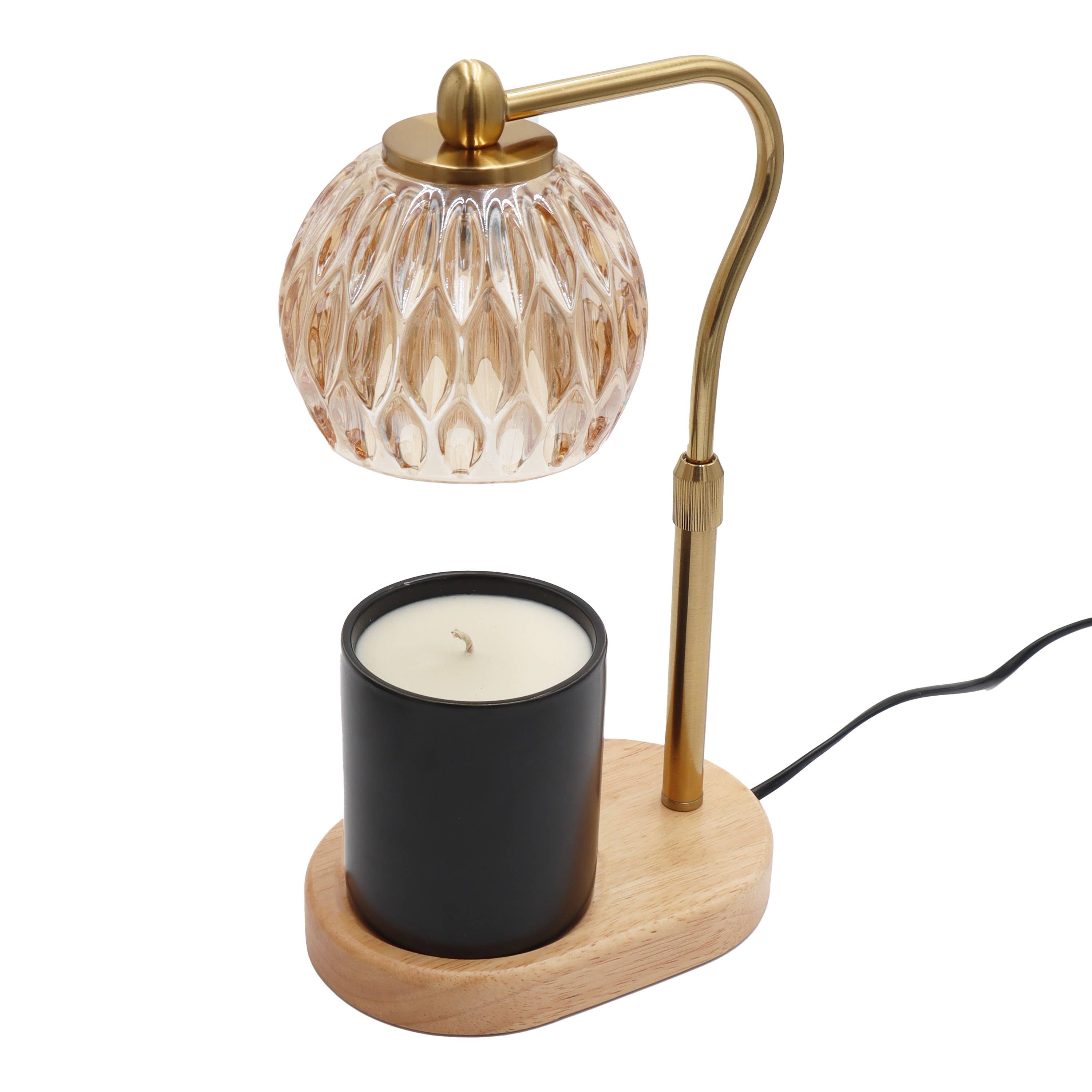 Candle warmer lamp with glass shade, brass arm, and black candle on a white background