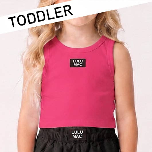 Child wearing a pink sleeveless top and black shorts with 'LULU MAC' branding on a white background.