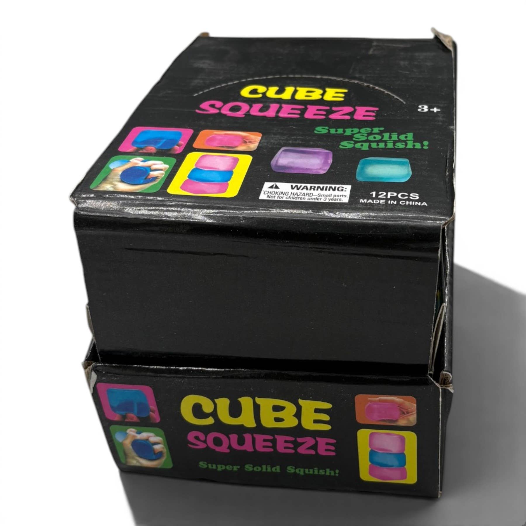 Box of Cube Squeeze toy with colorful cube illustrations on a white background
