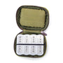 Green pill case with weekly compartments on a white background