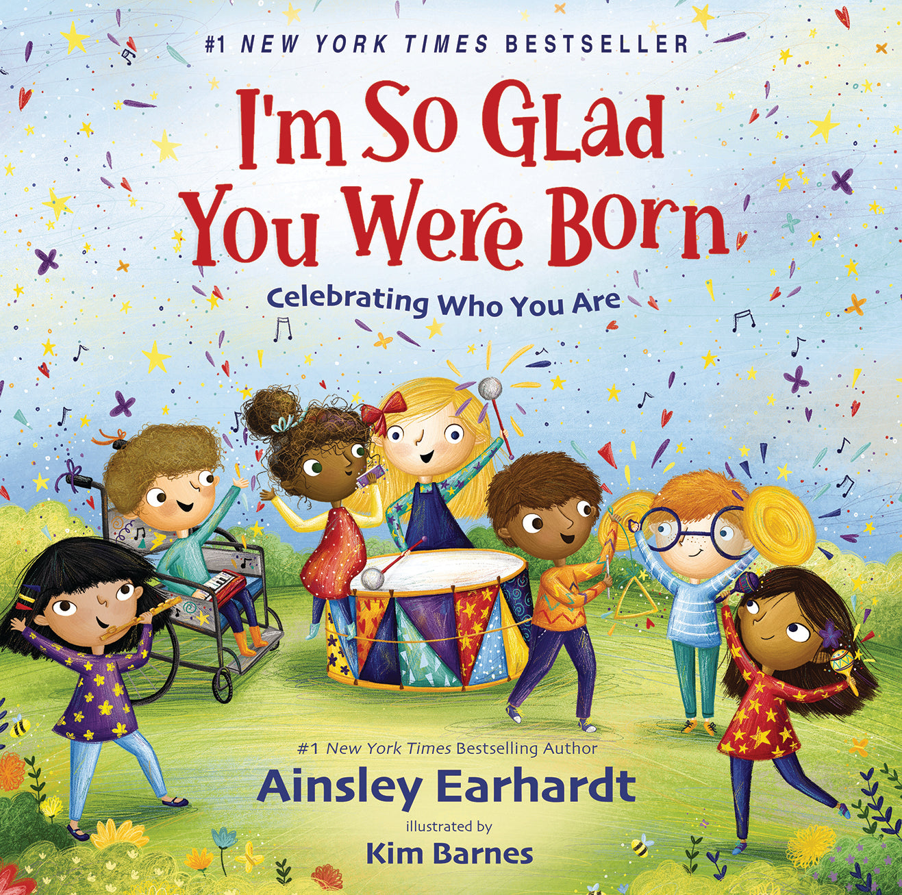 Book cover of 'I'm So Glad You Were Born' with children playing instruments and confetti.