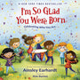 Book cover of 'I'm So Glad You Were Born' with children playing instruments and confetti.