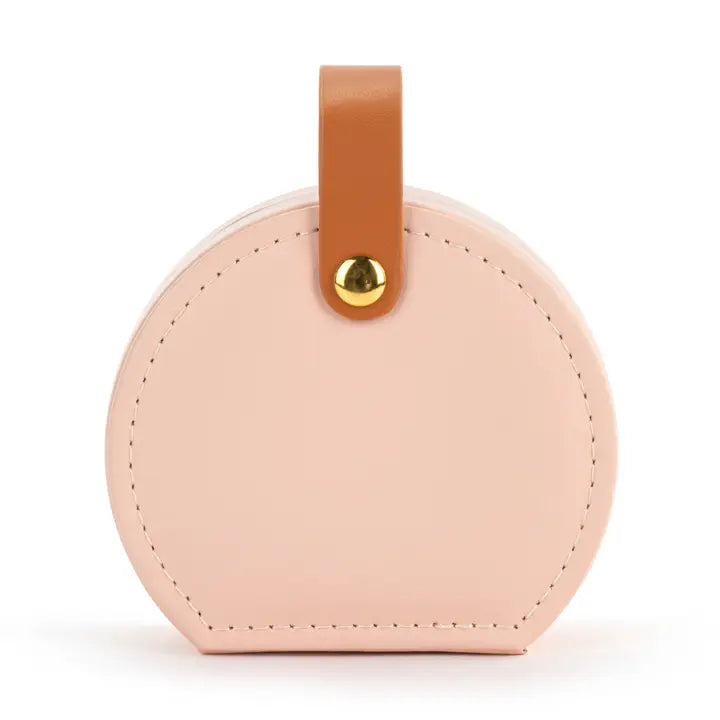 Round beige leather luggage tag with a brown strap and gold accent on a white background