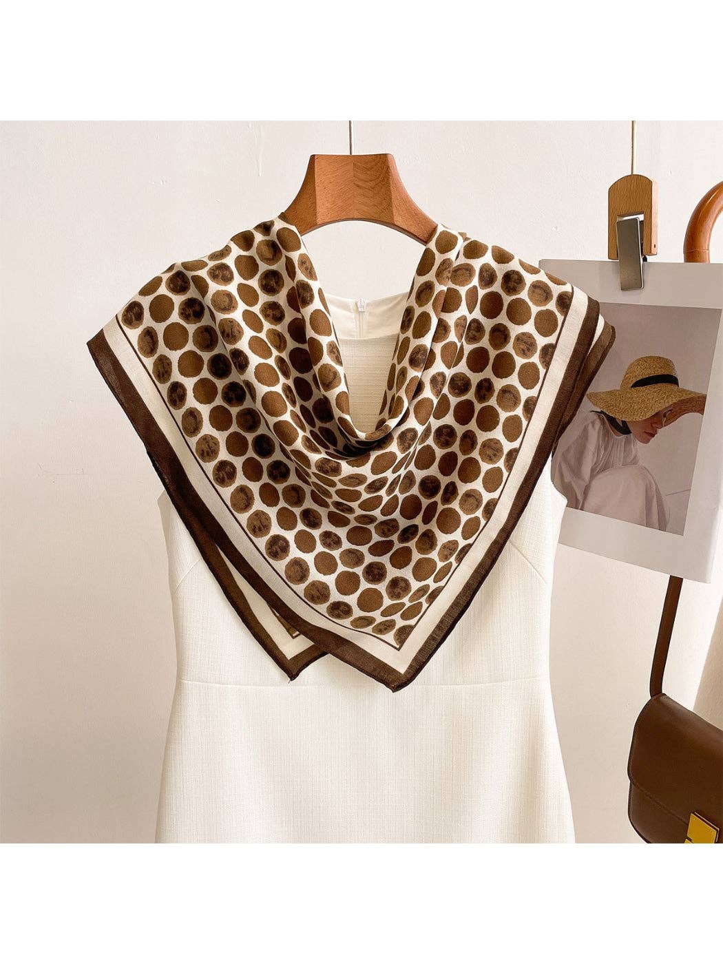 Coffee brown dot square scarf wrap with dark edge, draped around neckline