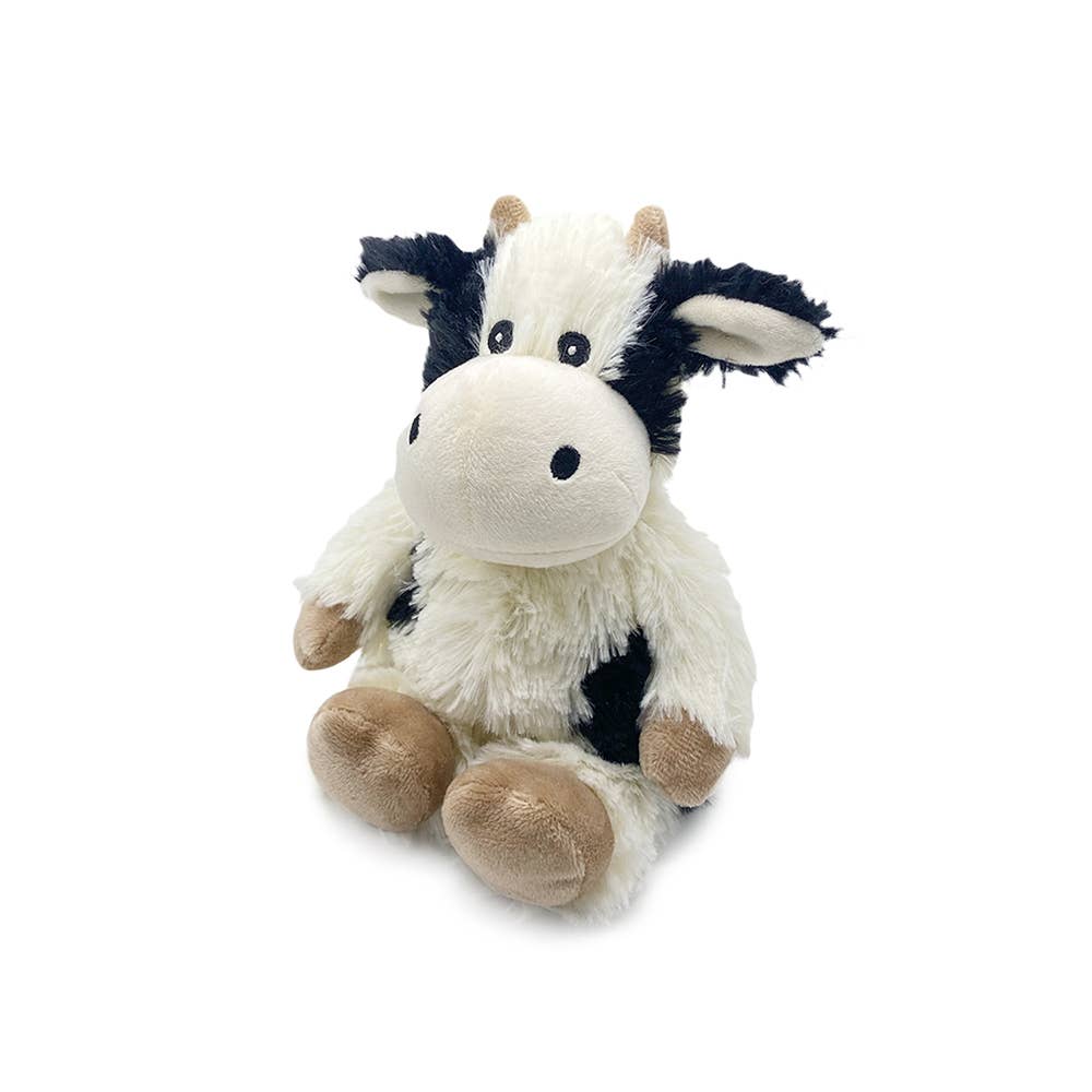 Plush cow toy with black patches and brown details on a white background