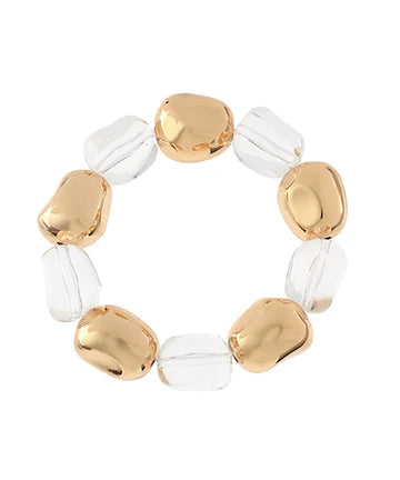 Bracelet with gold and clear beads on a white background