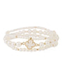 A multi-strand pearl bracelet with a gold-tone clover-shaped charm, displayed on a clean white background.