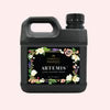 Jug of liquid with floral design on a black background