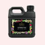 Black bottle with floral design on a white background
