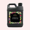 A bottle of laundry detergent with a decorative floral label on a white background