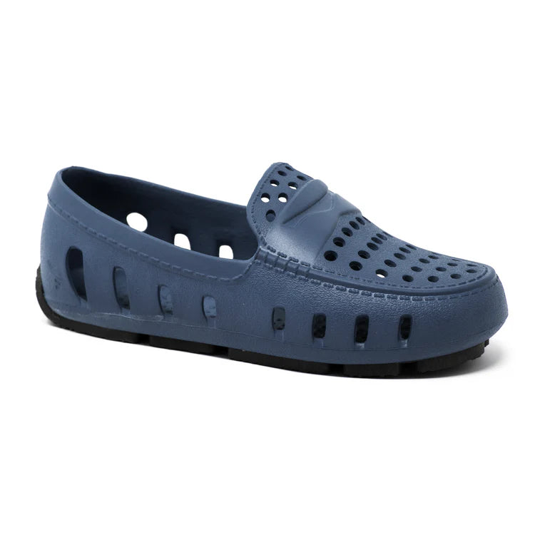 Blue shoe with open design on a white background