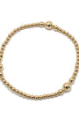 Gold beaded bracelet on a white background