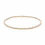 Gold beaded necklace on a white background