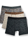 Three pairs of men's boxer briefs from Burlebo are displayed in a stacked arrangement on a white background. The front pair features a dark gray and black abstract camouflage pattern, the middle pair has a brown waistband and a beige print of small brown birds, and the back pair has a gray and brown tiger-stripe pattern.