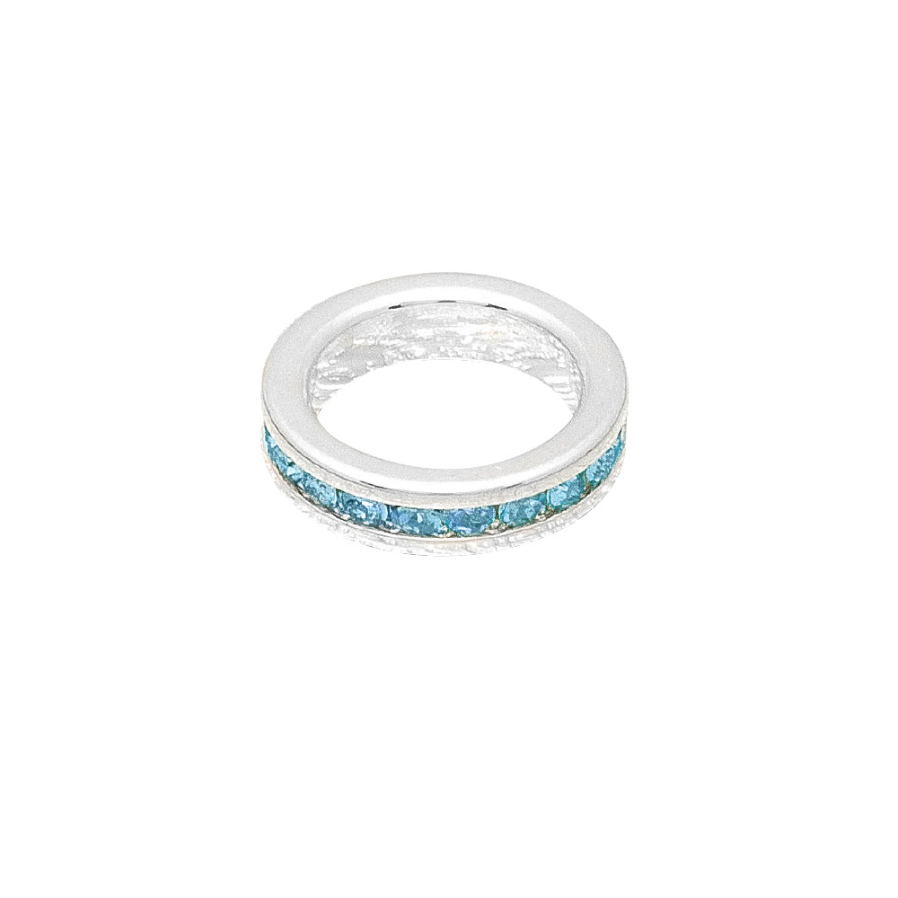 Silver ring with blue gemstones on a white background