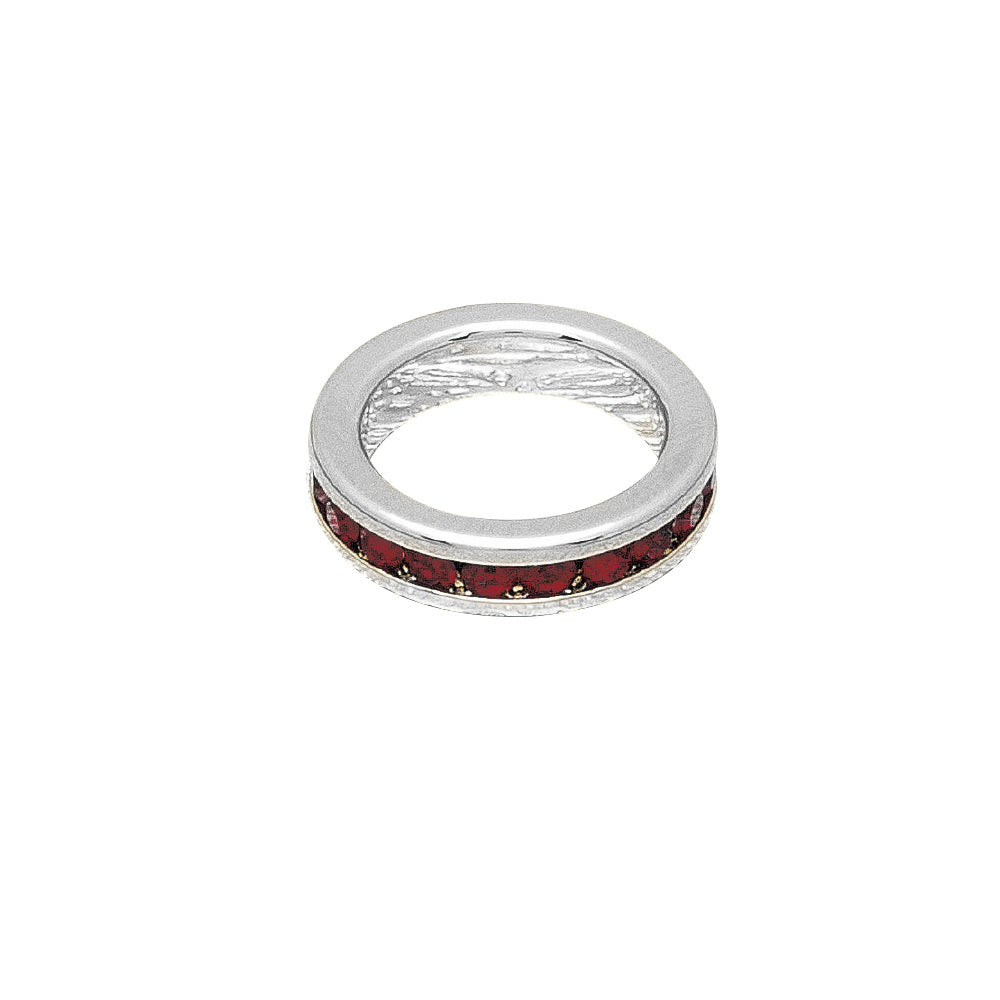 Silver charm with red stones on a white background