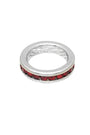 Silver ring with red gemstones on a white background