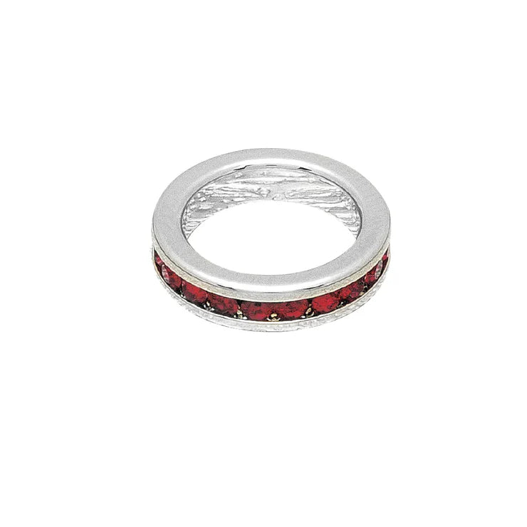 Silver ring with red gemstones on a white background