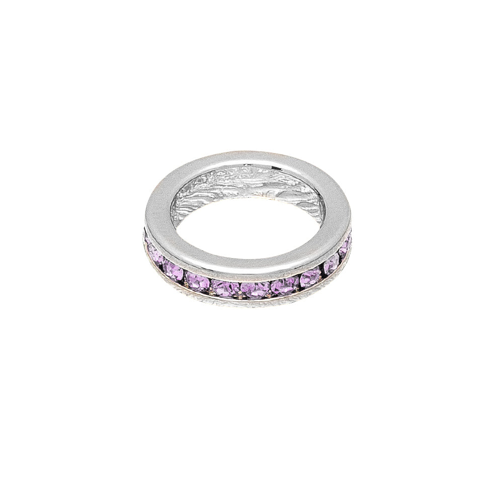 Silver ring with pink gemstones on a white background