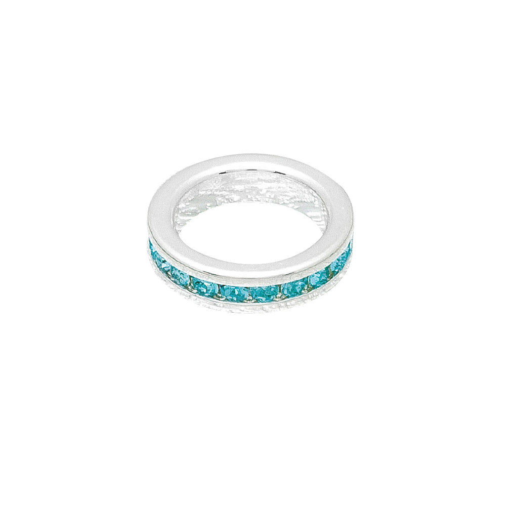 Silver ring with turquoise stones on a white background