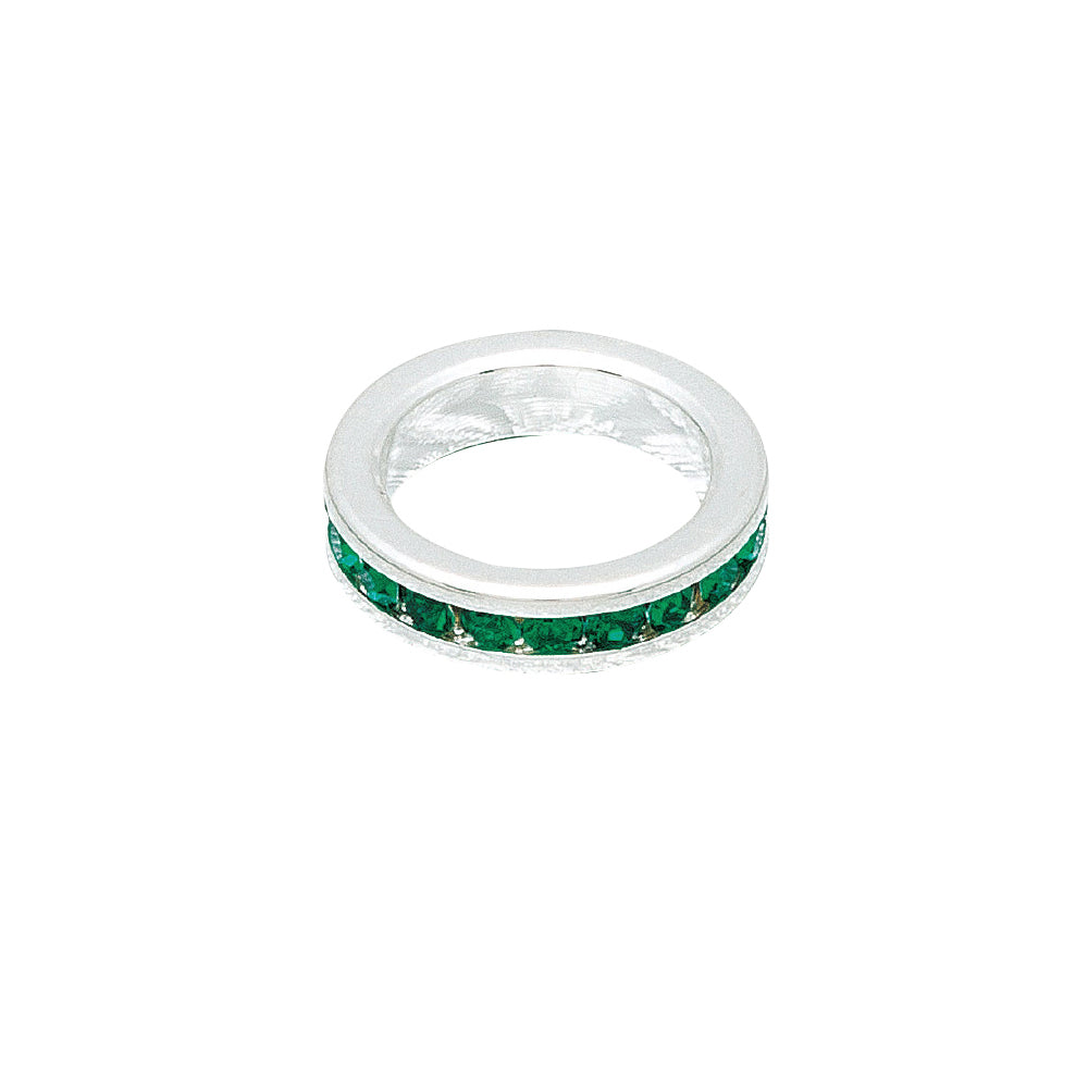 Silver ring with green gemstones on a white background