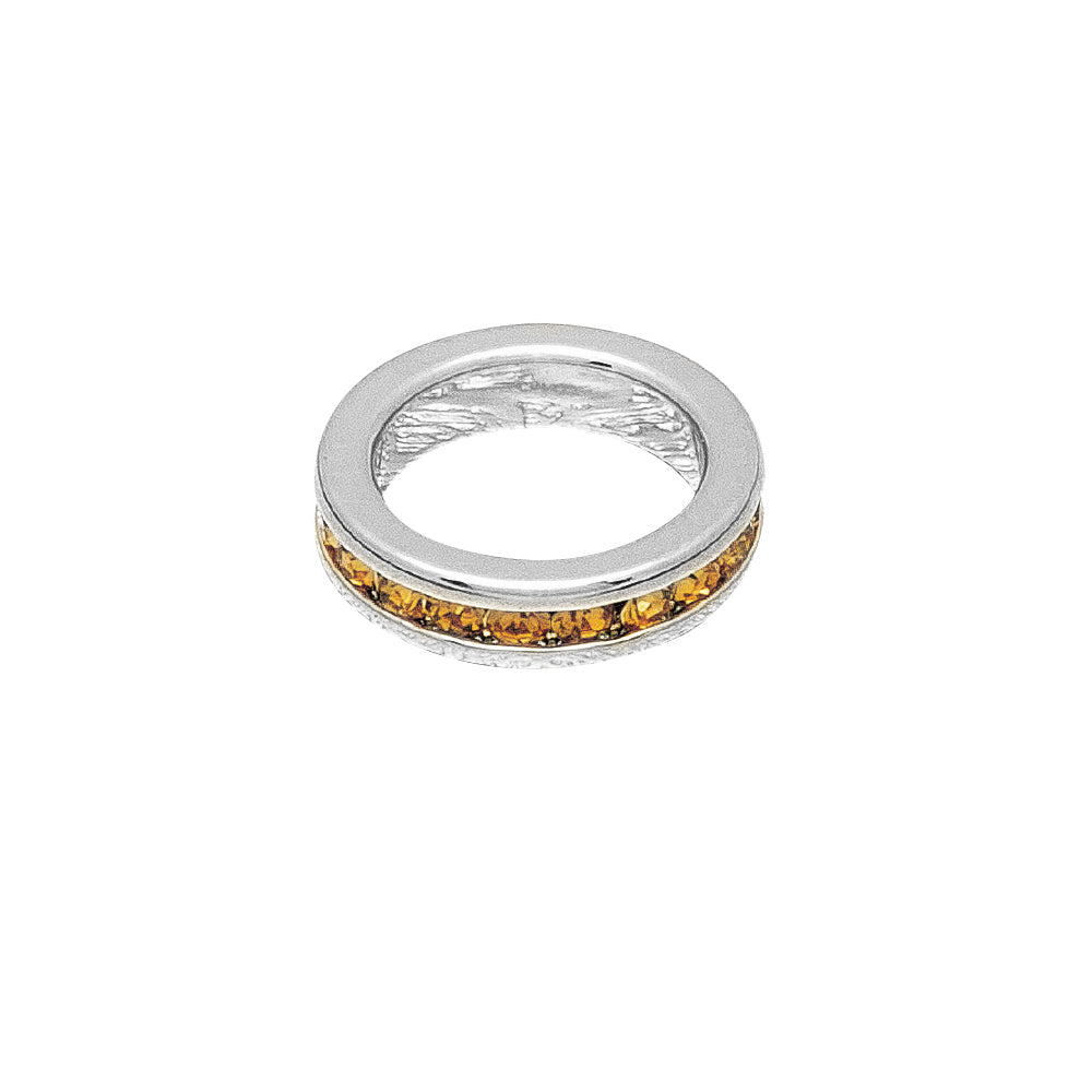 Silver ring with embedded amber stones on a white background