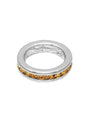 Silver ring with embedded amber stones on a white background