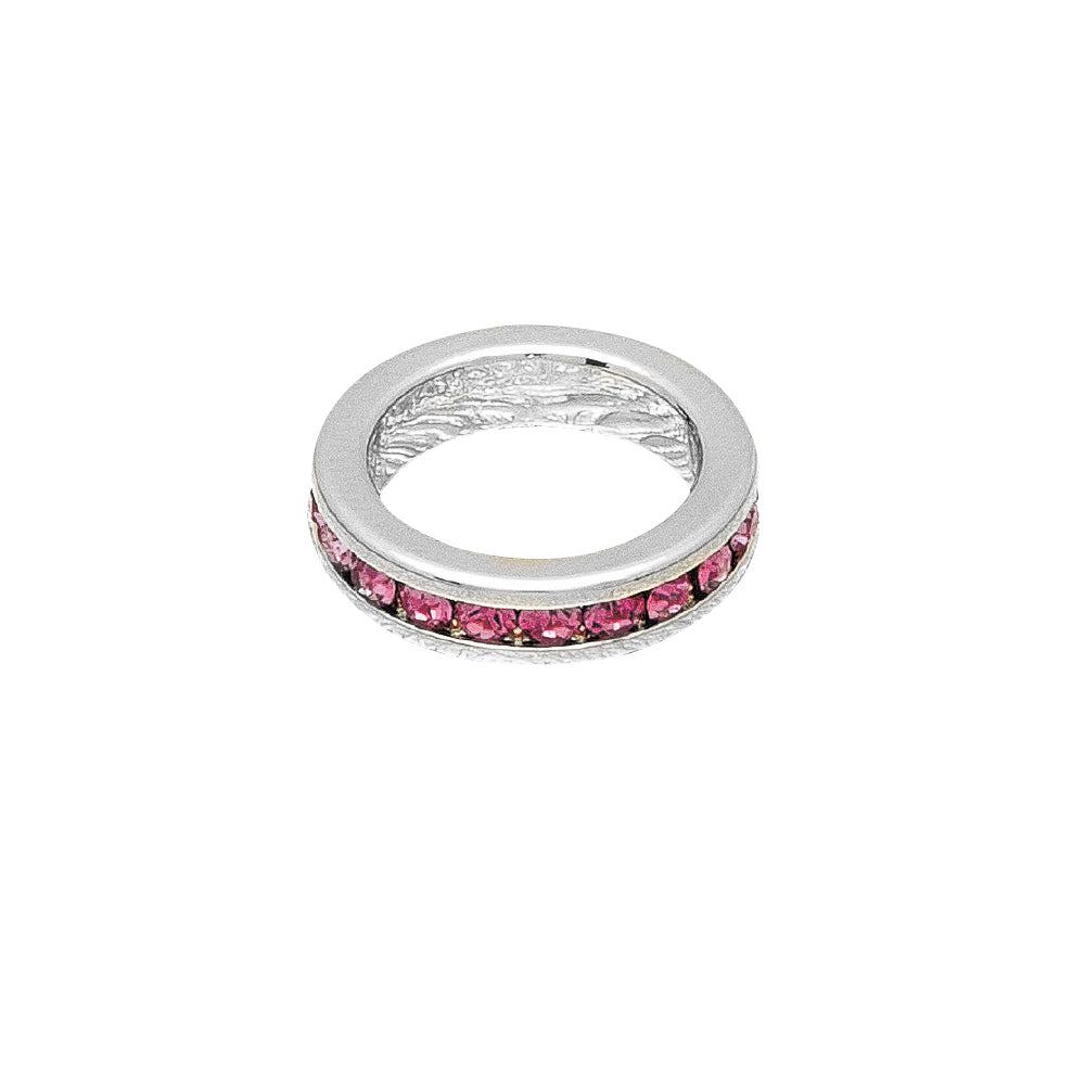 Silver ring with pink gemstones on a white background