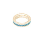 Gold ring with blue gemstones on a white background