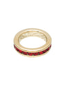 Gold ring with red gemstones on a white background