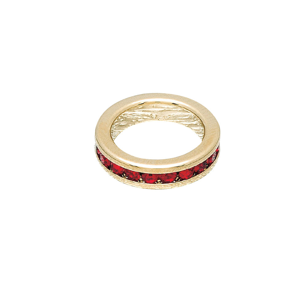 Gold ring with red gemstones on a white background