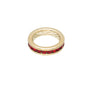 Gold ring with red gemstones on a white background