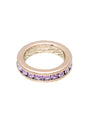 Gold ring with purple gemstones on a white background