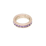 Gold ring with purple gemstones on a white background