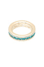 Gold ring with turquoise stones on a white background