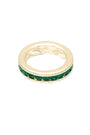 Gold ring with green gemstones on a white background