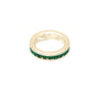 Gold ring with green gemstones on a white background