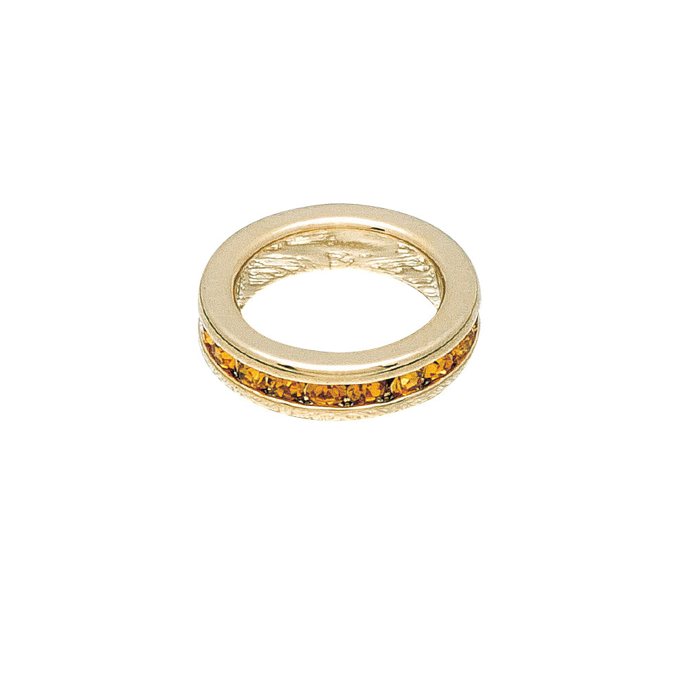 Gold ring with embedded stones on a white background